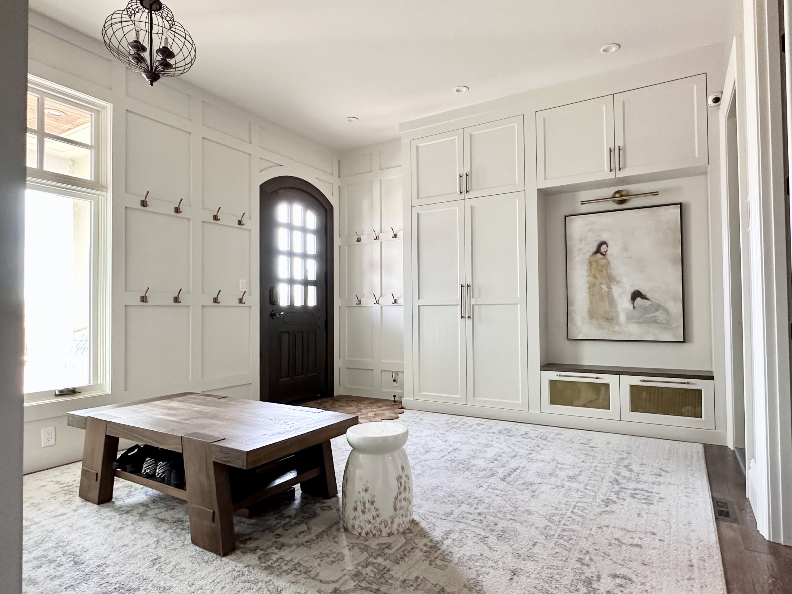 Custom mudroom design and wood paneling modern farmhouse